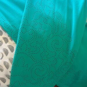 Large green Athleta leggings with cutout design on legs. Barely worn.